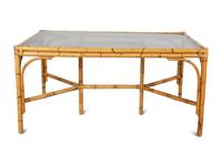 A Bamboo and Rattan Dining Set comprising a table and six chairs.