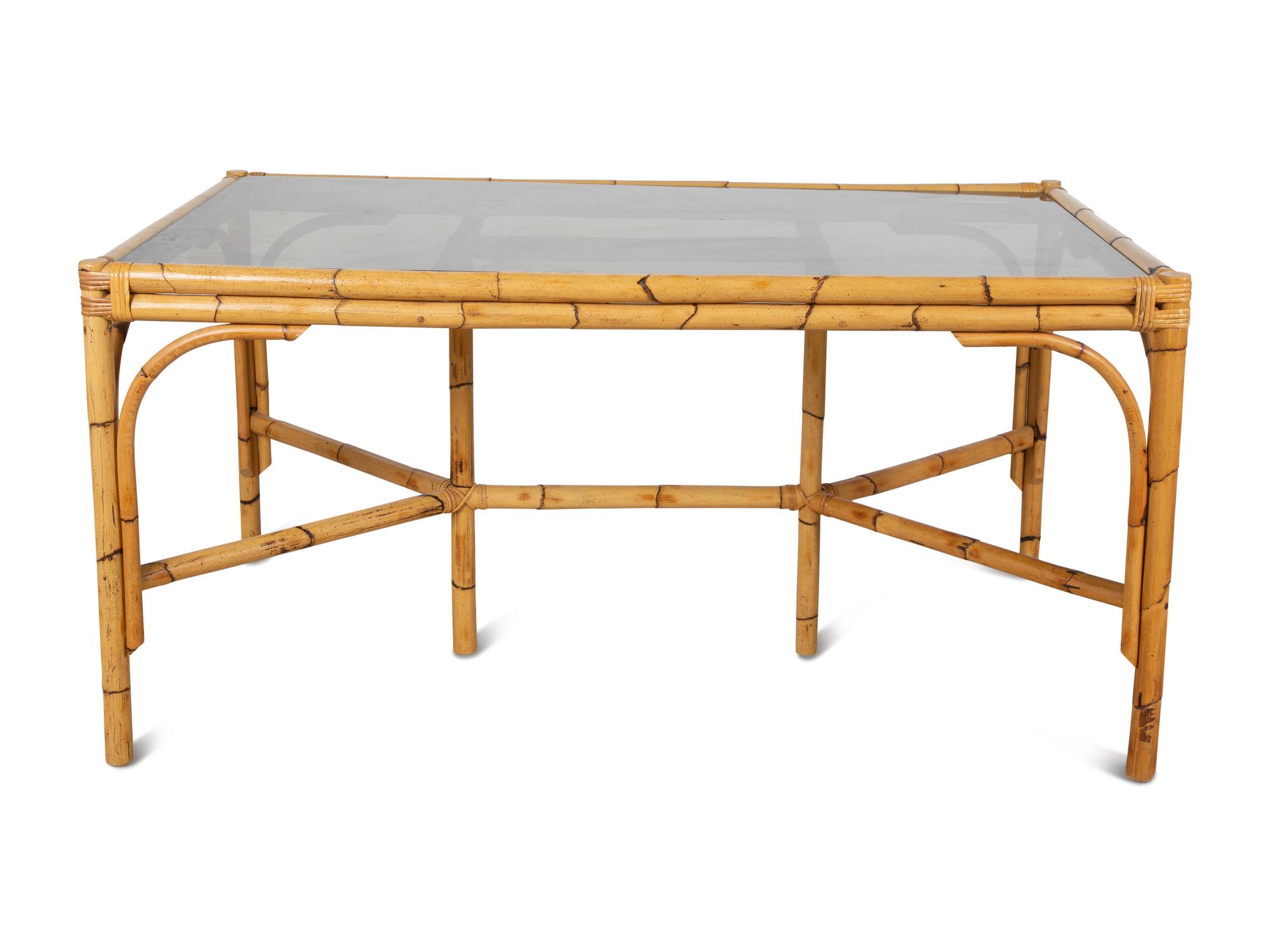 A Bamboo and Rattan Dining Set comprising a table and six chairs.