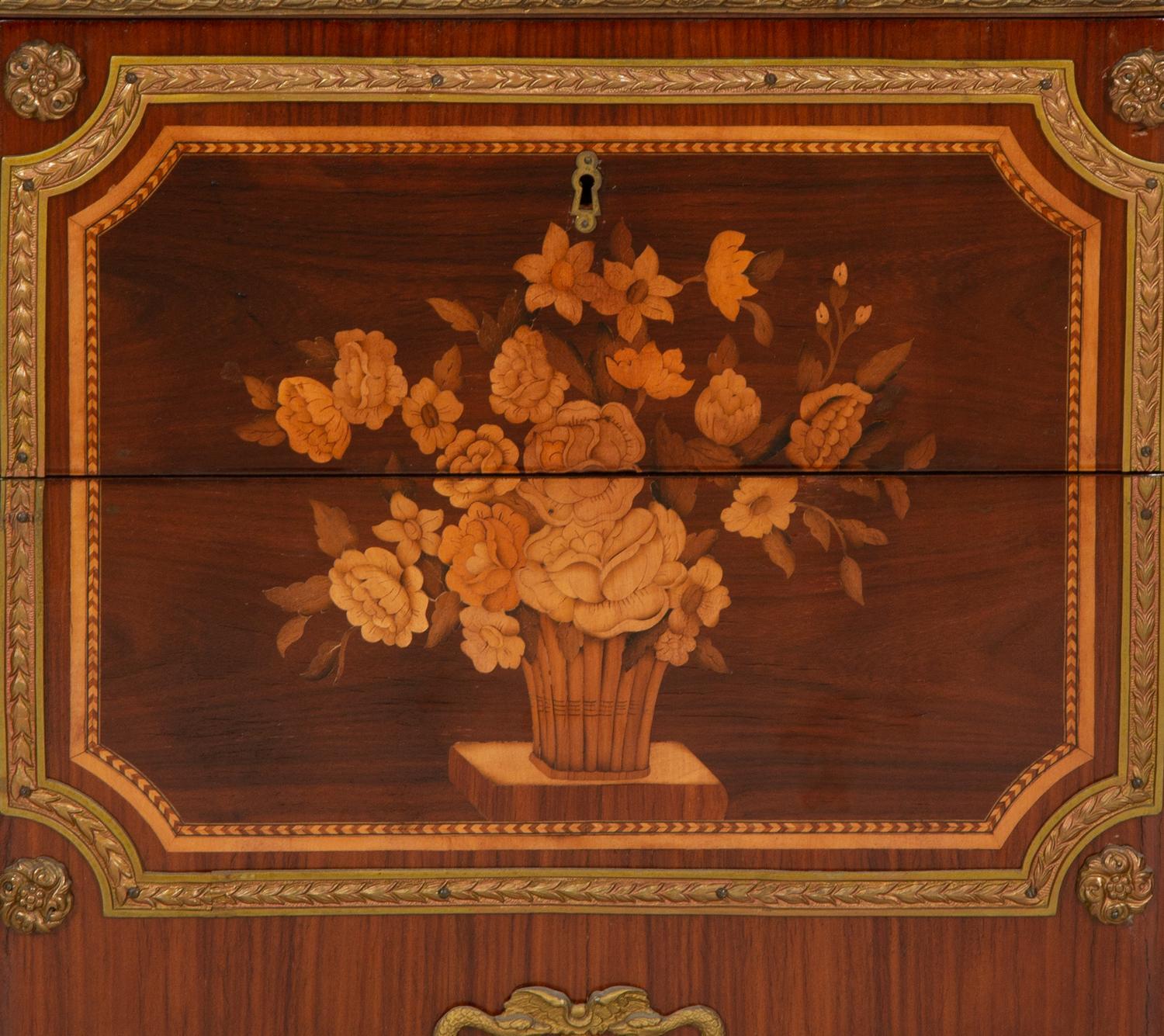 A Louis XV/XVI Transitional Style Gilt Metal Mounted Marquetry Marble-Top Commode