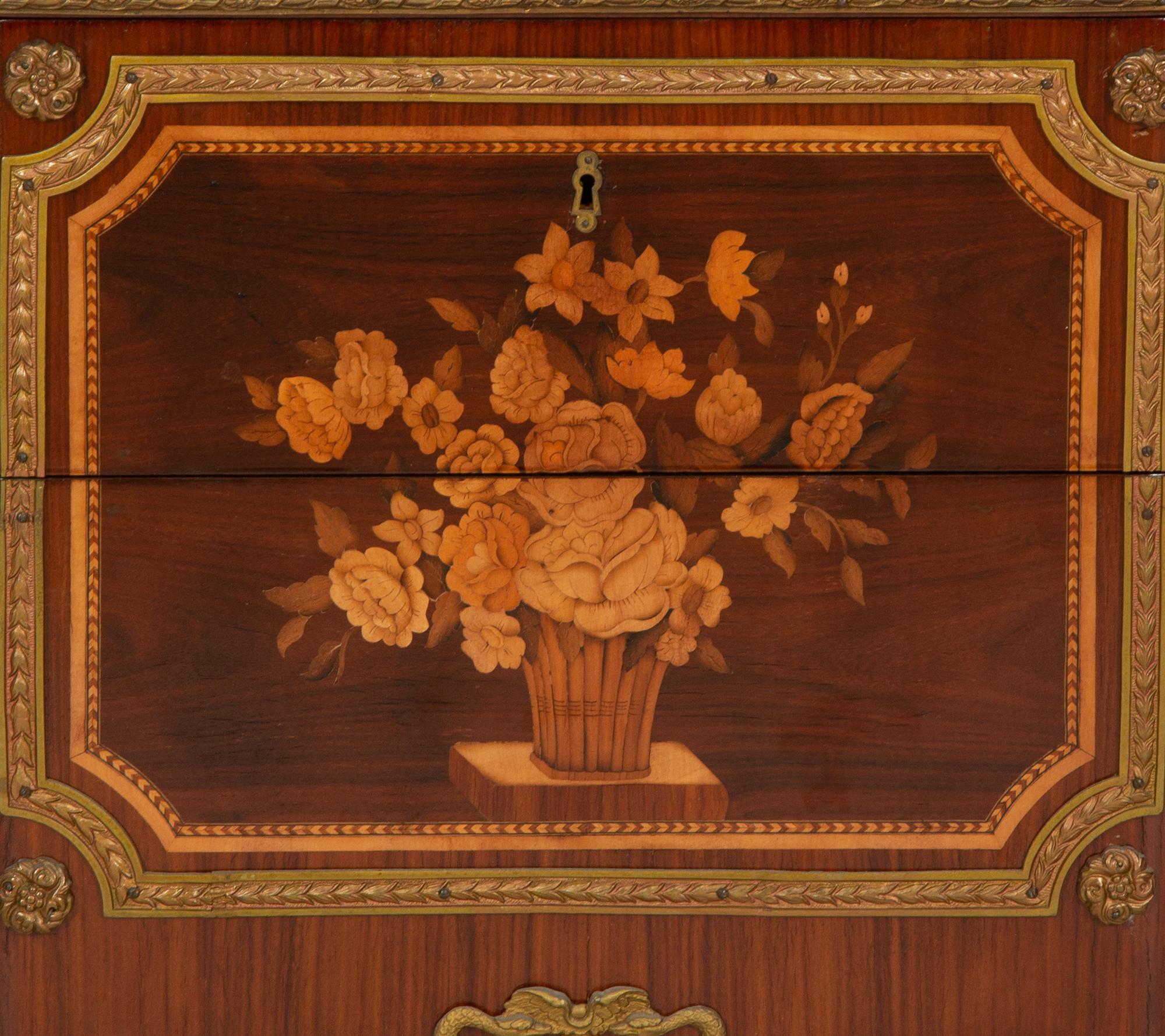 A Louis XV/XVI Transitional Style Gilt Metal Mounted Marquetry Marble-Top Commode
