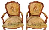 A Pair of Louis XV Fruitwood Fauteuils
