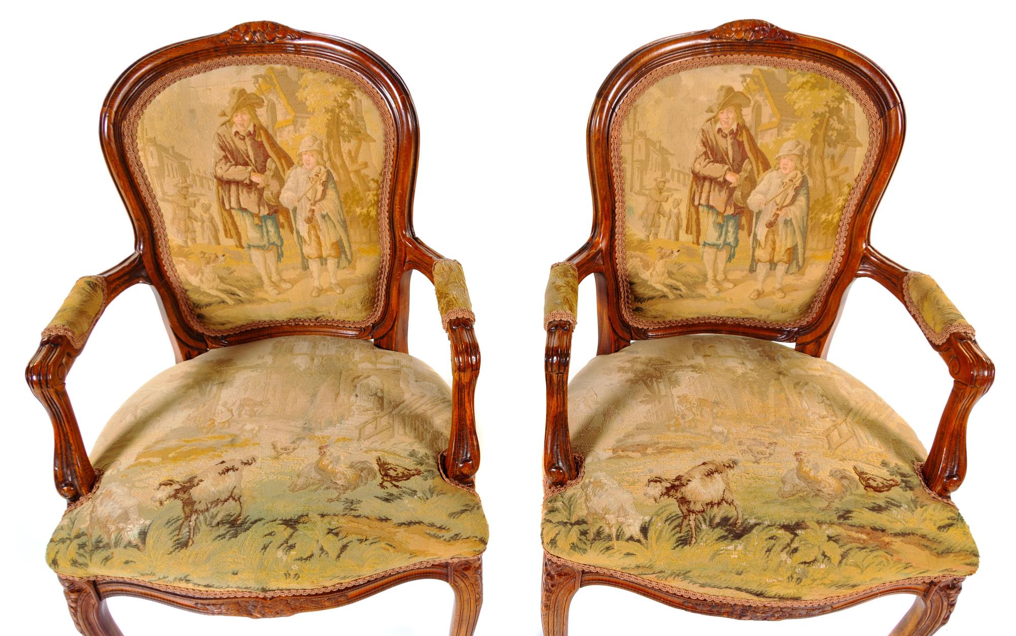 A Pair of Louis XV Fruitwood Fauteuils