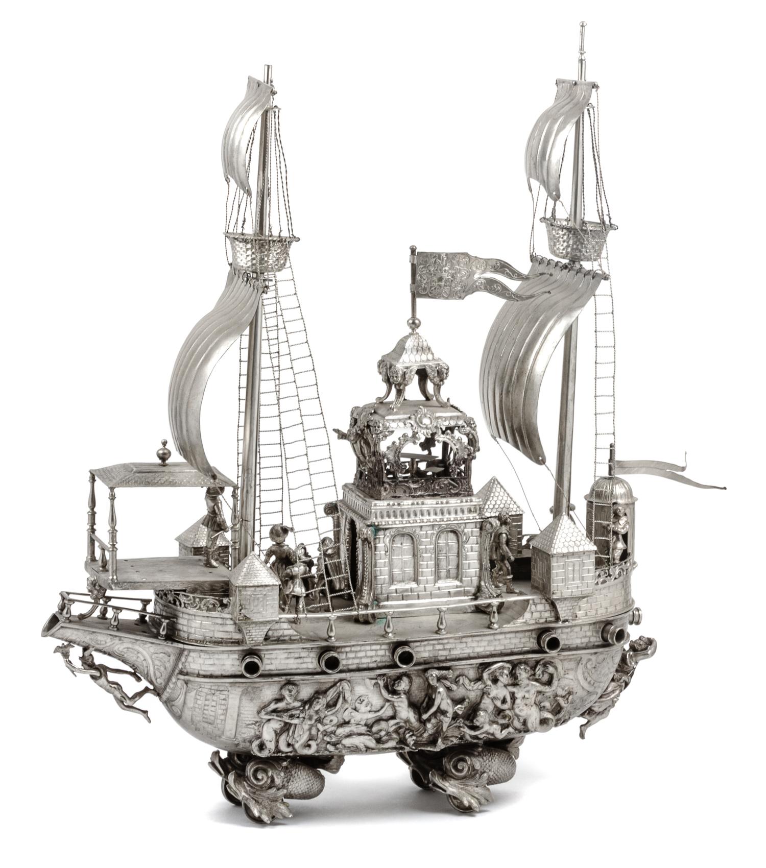 A Continental Silvered Metal Nef Height 21 1/4 x width 19 x depth 6 1/4 inches.