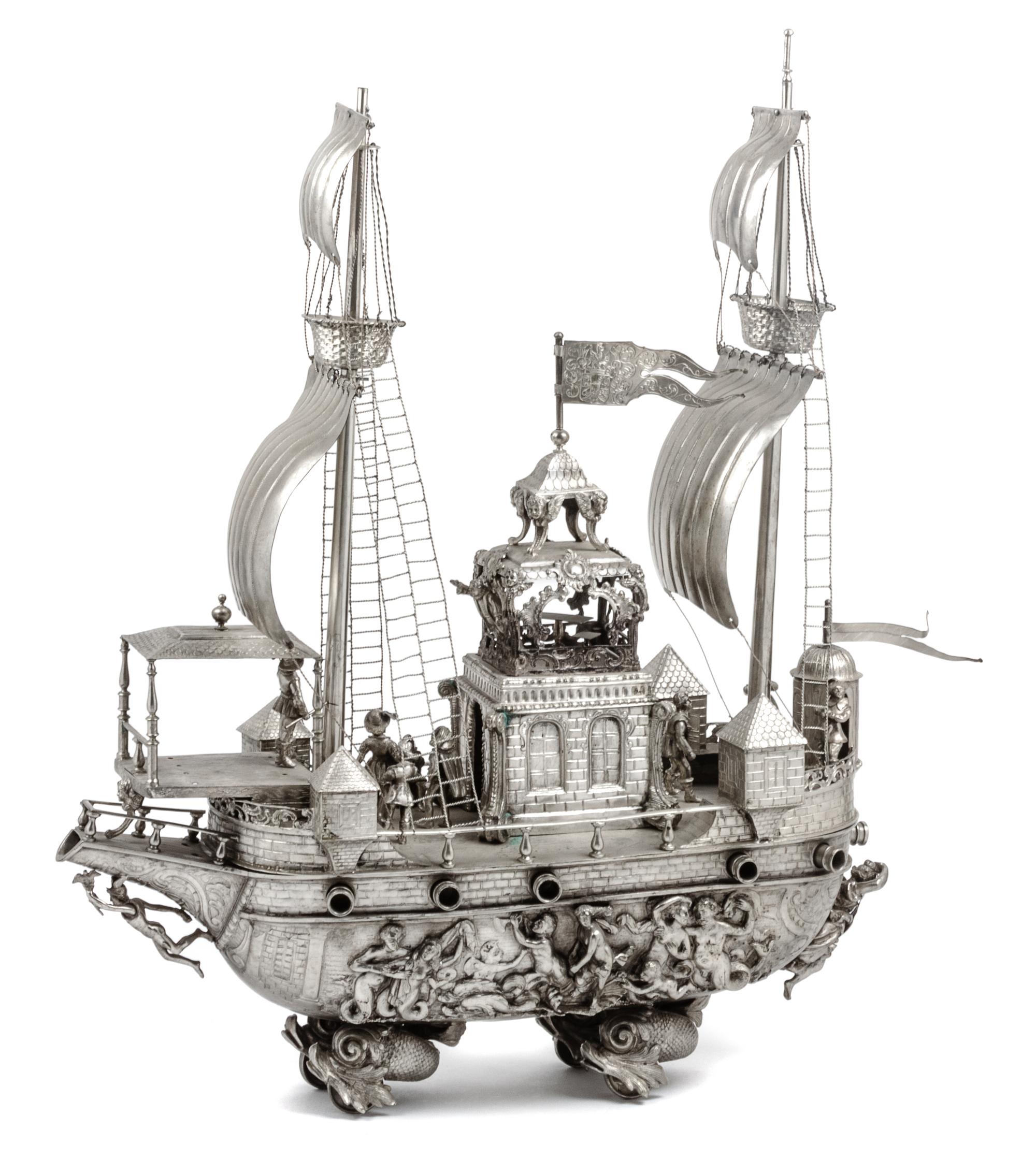 A Continental Silvered Metal Nef Height 21 1/4 x width 19 x depth 6 1/4 inches.