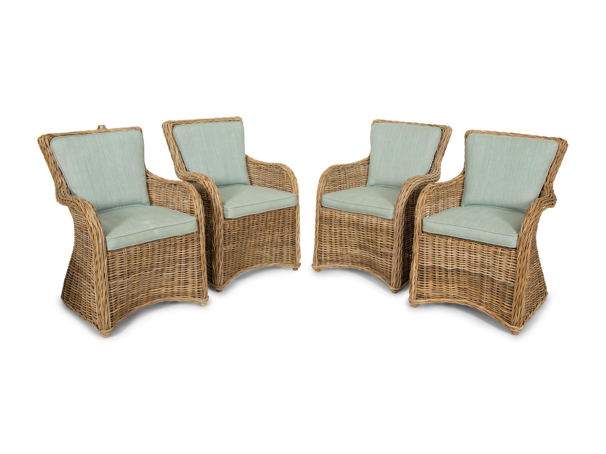A Set of Four Rattan Armchairs with Seat and Back Cushions