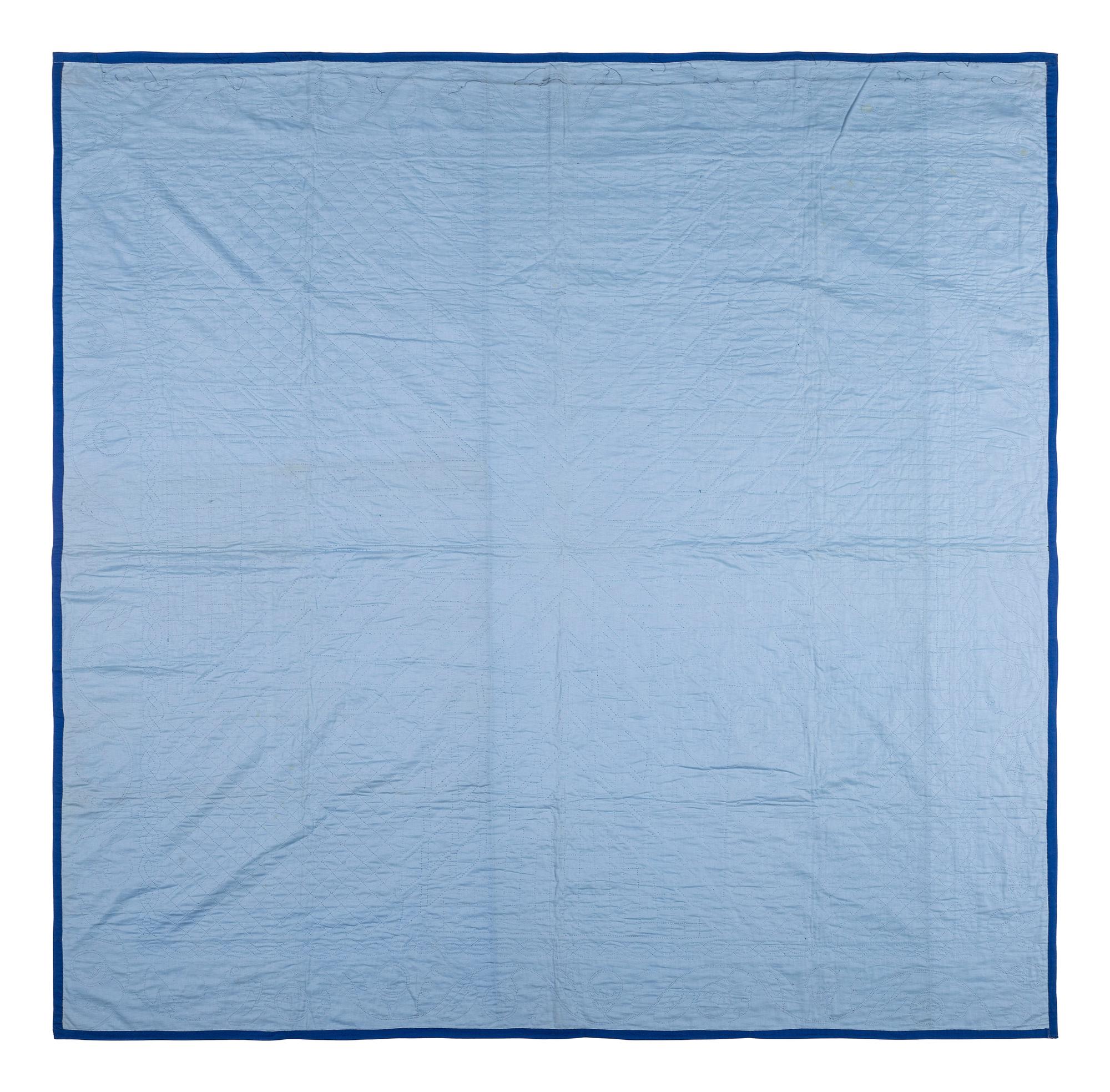 An Amish Eight Point Star Pieced Cotton and Satin Quilt