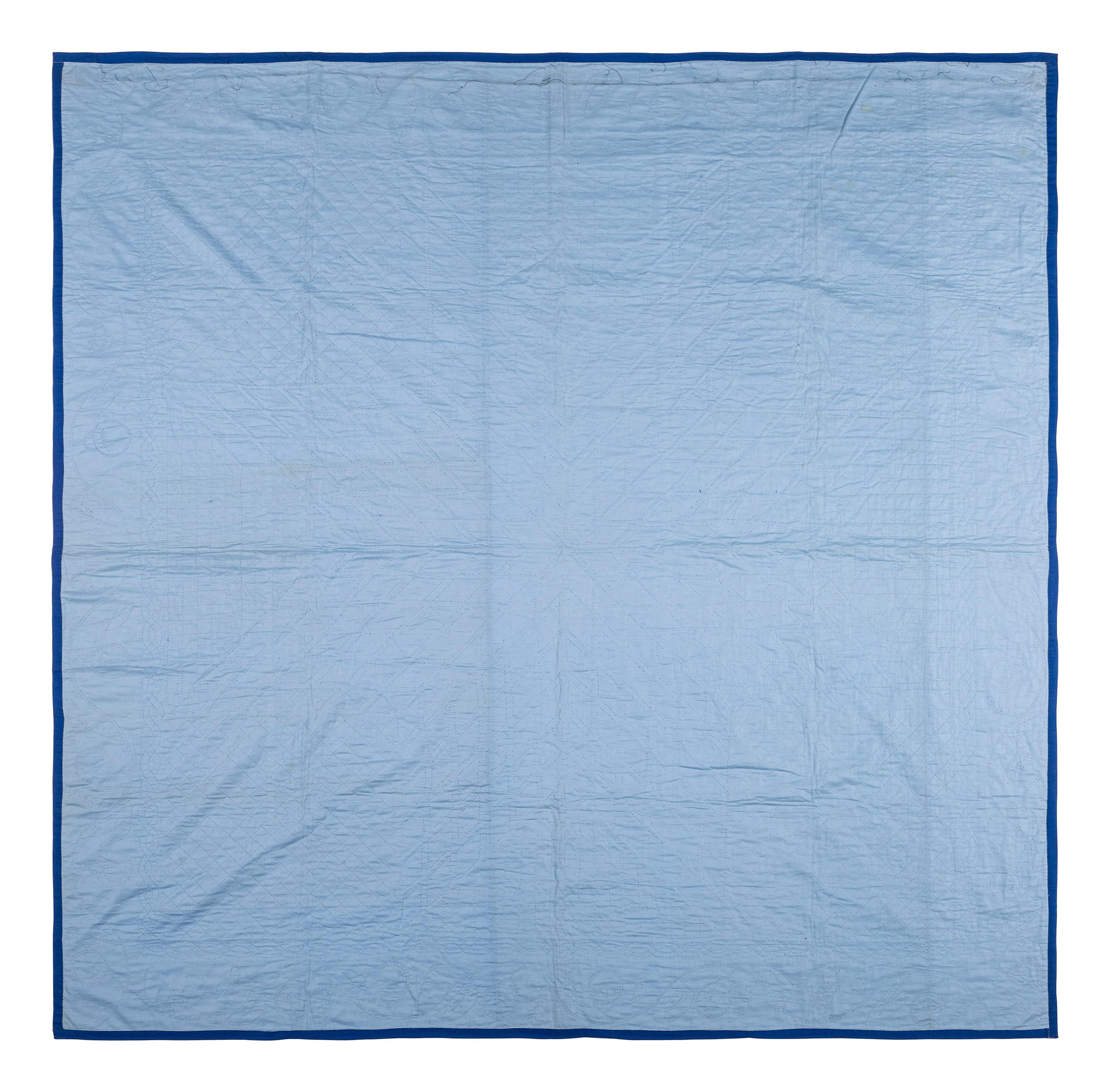 An Amish Eight Point Star Pieced Cotton and Satin Quilt