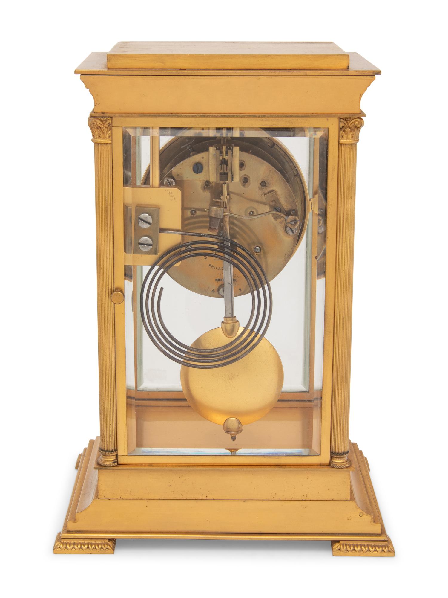 A Continental Gilt Bronze and Champlevé Mantel Clock