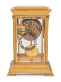 A Continental Gilt Bronze and Champlevé Mantel Clock