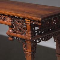 A Chinese Carved Huanghuali Side Table, Tiaozhuo, Late 19th to 20th Century 晚清民國 黃花梨透雕夔龍紋條桌