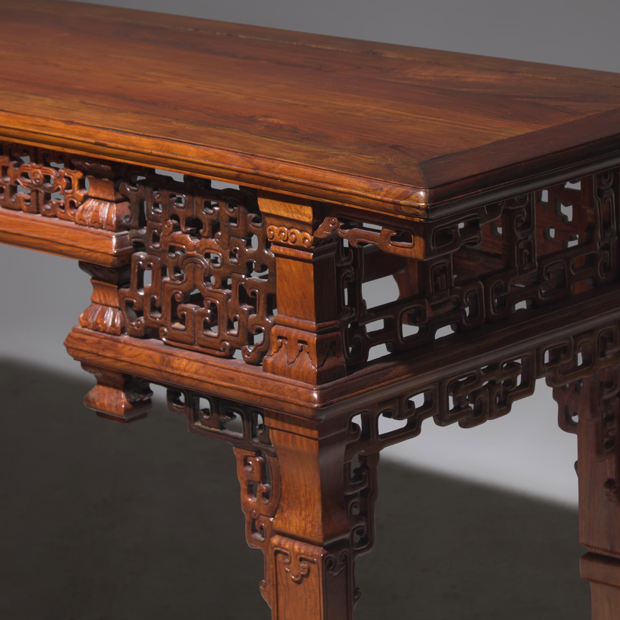 A Chinese Carved Huanghuali Side Table, Tiaozhuo, Late 19th to 20th Century 晚清民國 黃花梨透雕夔龍紋條桌