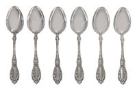 A Set of Twelve American Silver Tablespoons, Maker's Mark M in a Lozenge, each handle decorated with two putti, monogrammed LDG on the