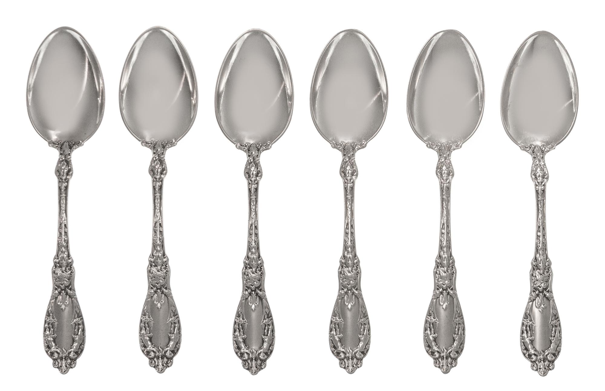 A Set of Twelve American Silver Tablespoons, Maker's Mark M in a Lozenge, each handle decorated with two putti, monogrammed LDG on the