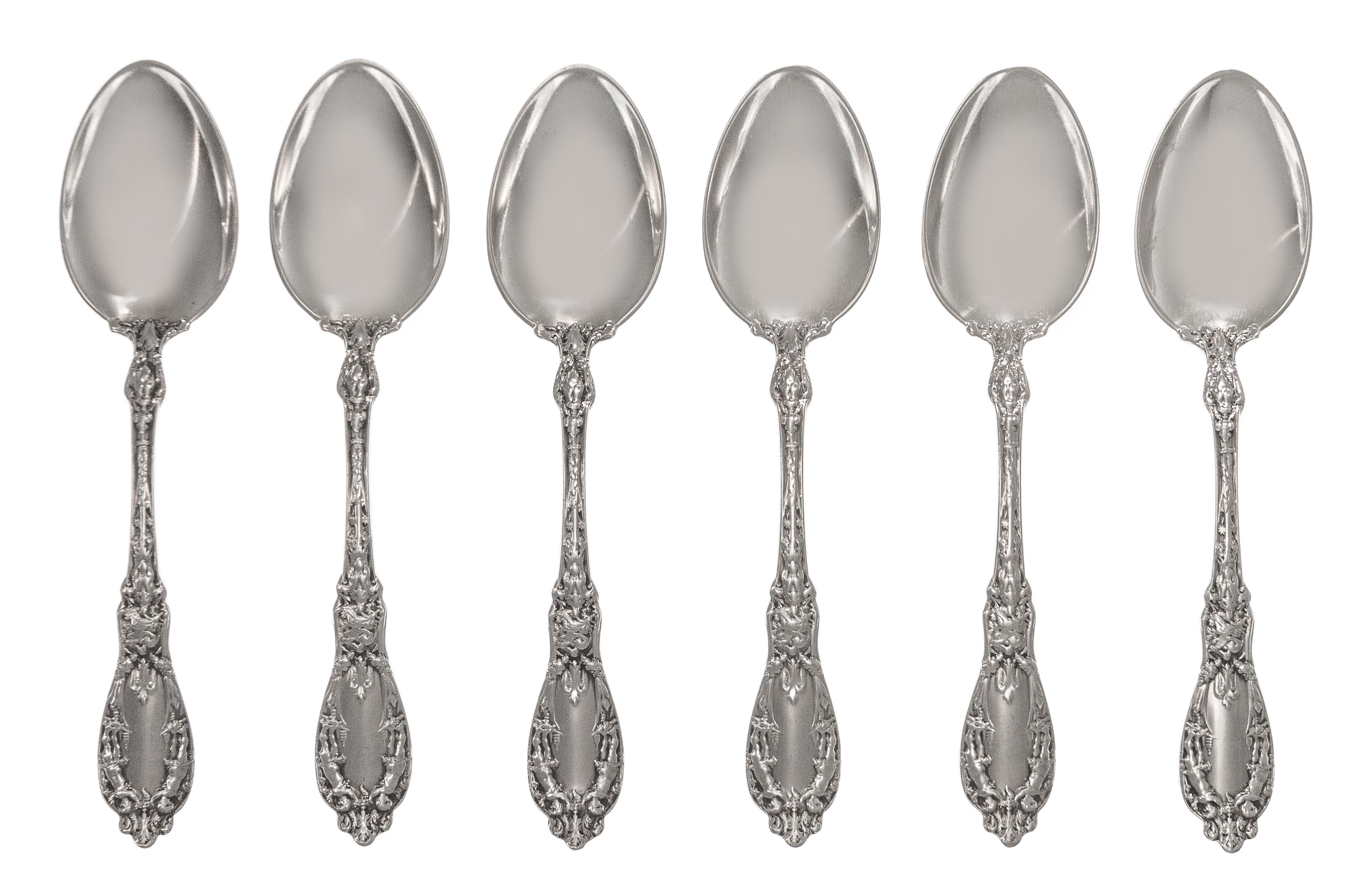 A Set of Twelve American Silver Tablespoons, Maker's Mark M in a Lozenge, each handle decorated with two putti, monogrammed LDG on the