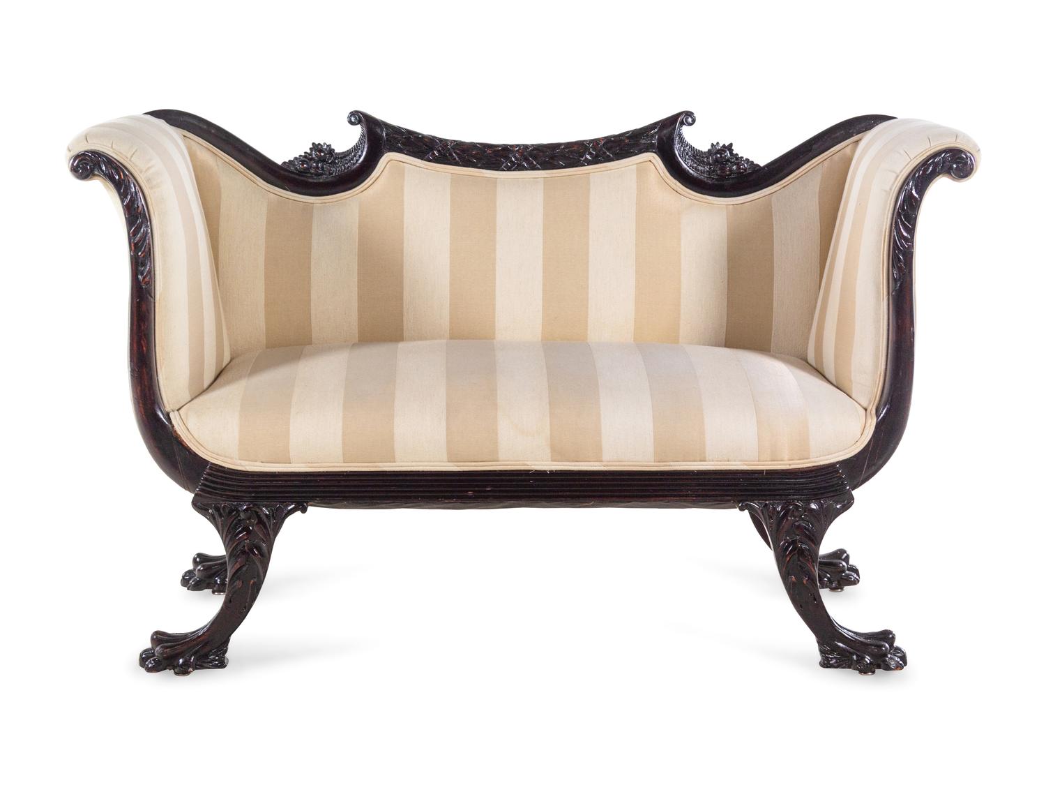 A Victorian Mahogany Settee and Armchair