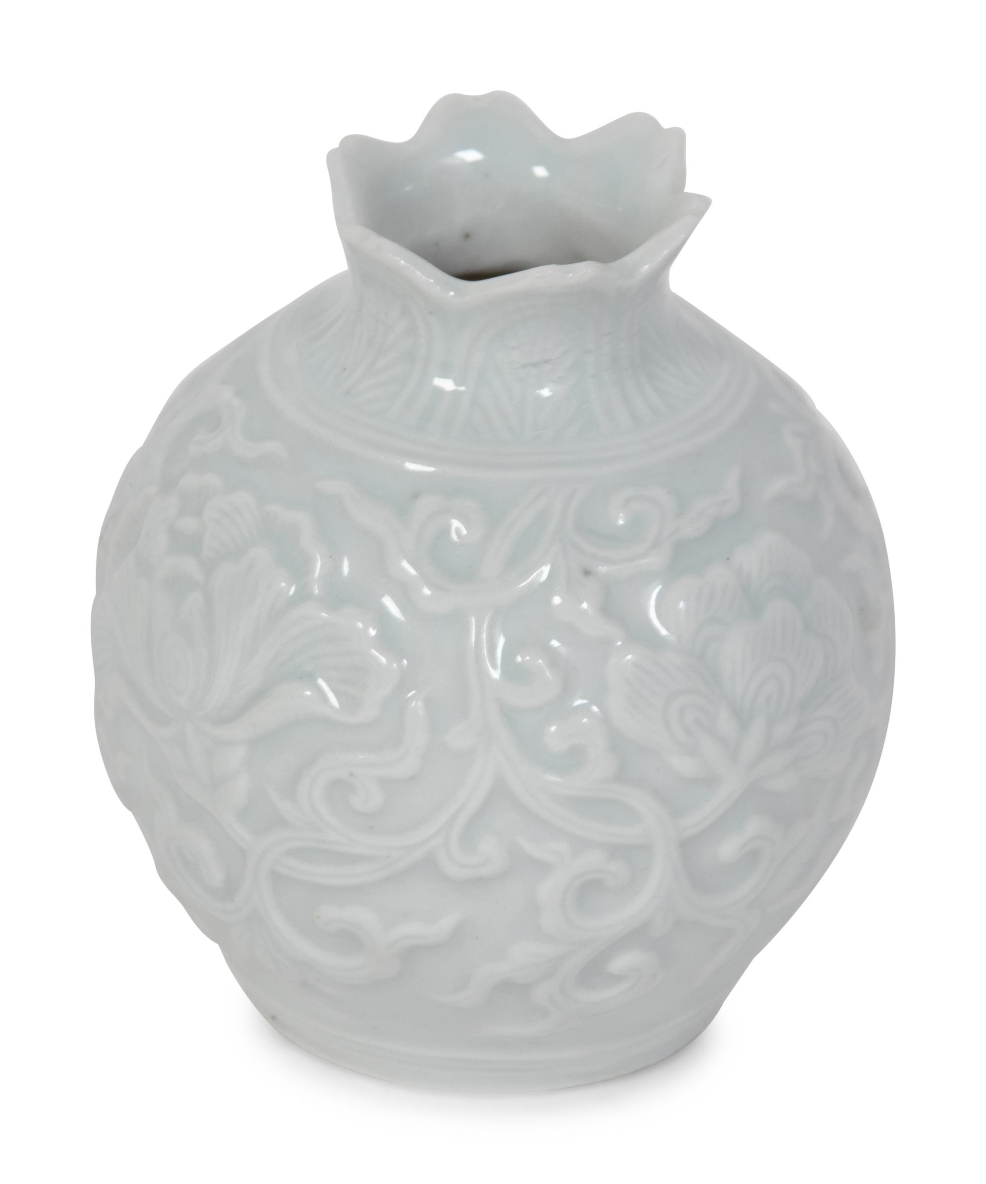 A Japanese Carved White Glazed Porcelain Pomegranate-Form Jar