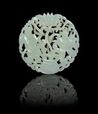 A Pierce Carved Jade Circular Plaque Diameter 2 1/8 inches.