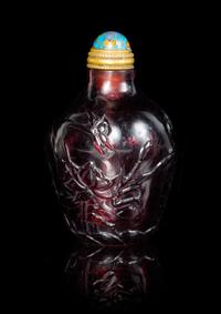An Amethyst Tone Glass Snuff Bottle Height 2 1/2 inches.