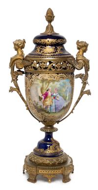 A Sevres Gilt Bronze Mounted Porcelain Urn Height 29 1/2 inches.