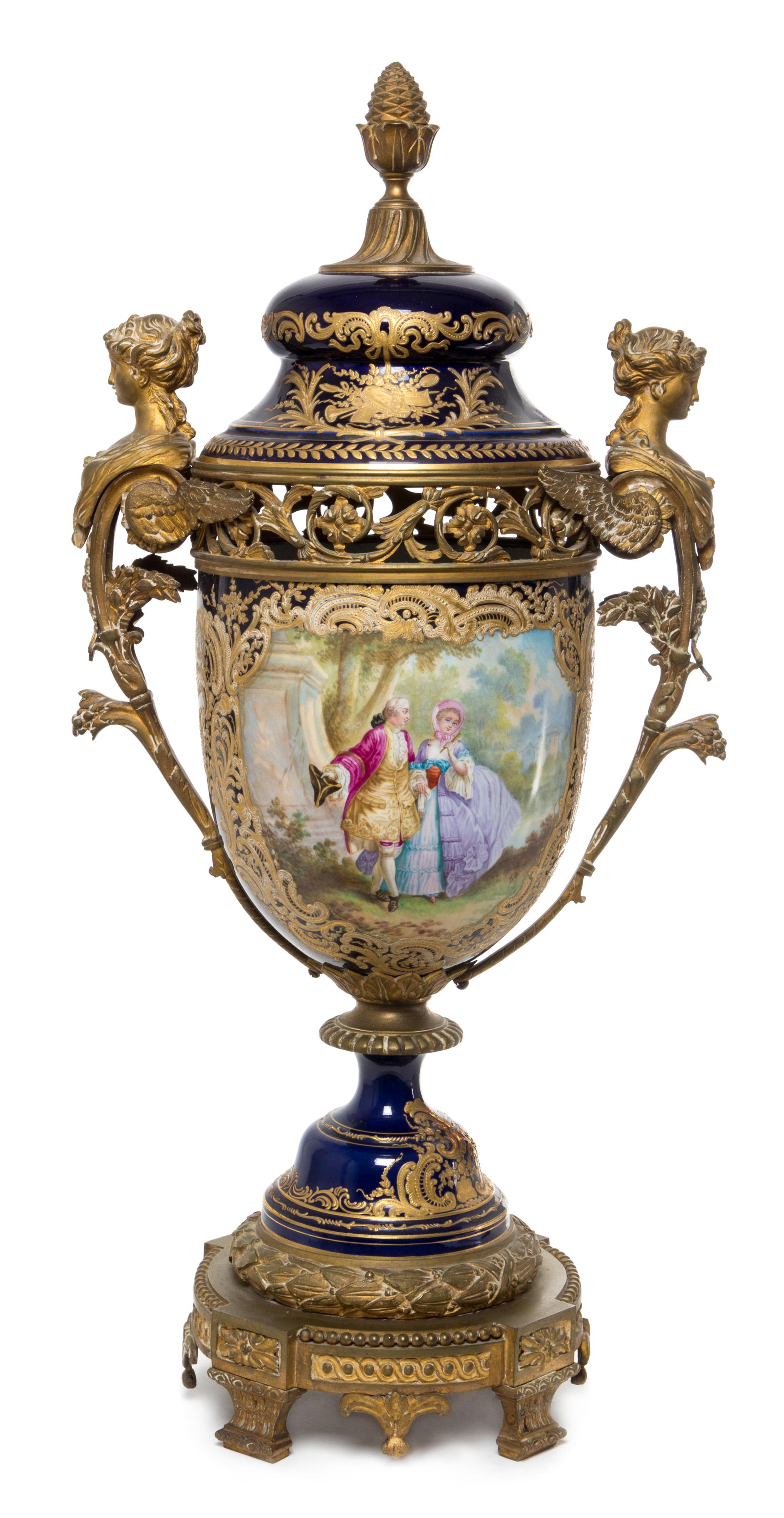 A Sevres Gilt Bronze Mounted Porcelain Urn Height 29 1/2 inches.