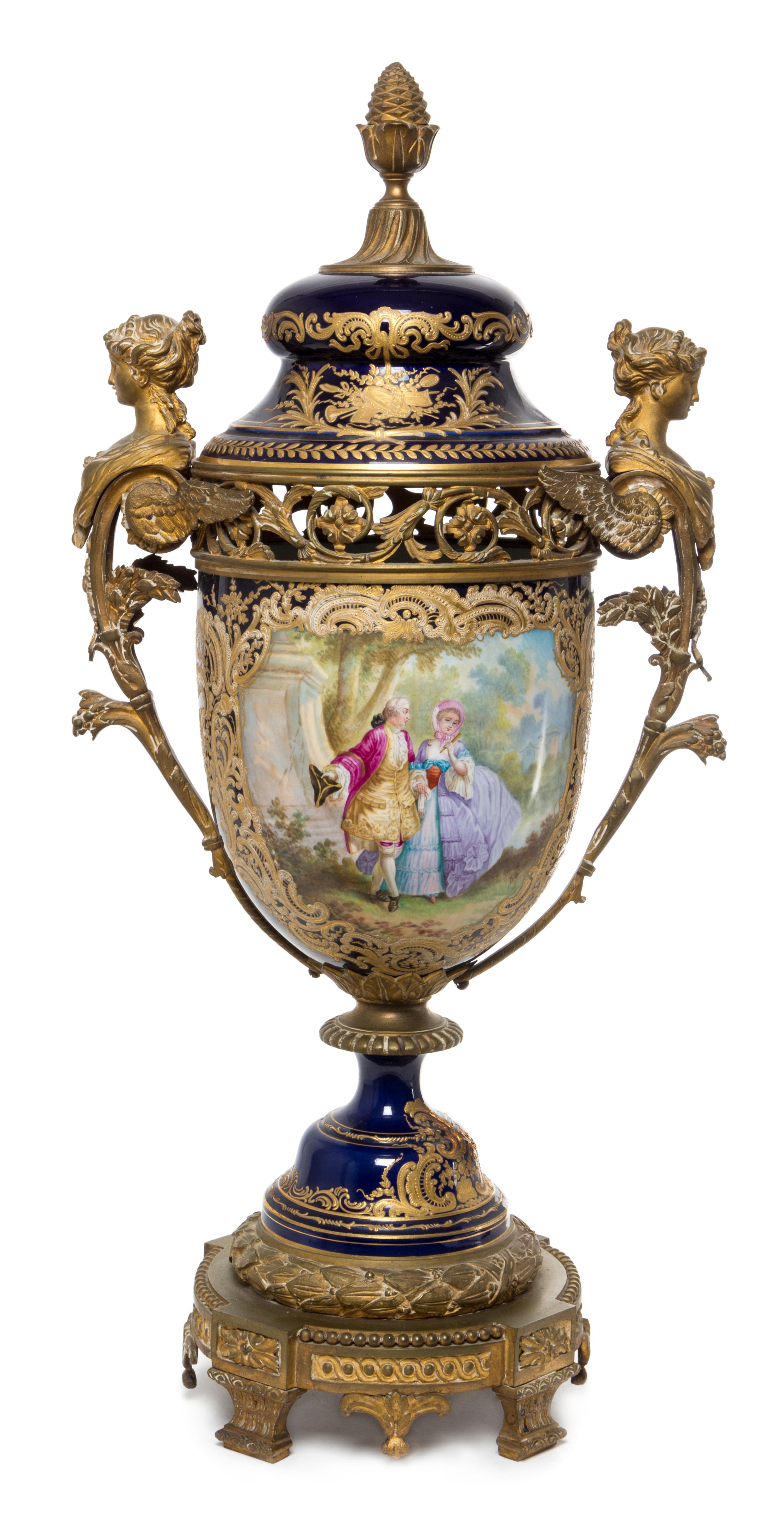 A Sevres Gilt Bronze Mounted Porcelain Urn Height 29 1/2 inches.