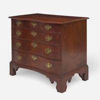 A Chippendale reverse serpentine carved maple and birch chest of drawers New England, circa 1785