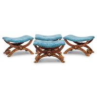 A Set of Four Italian Neoclassical Style Carved and Parcel Gilt Walnut Benches