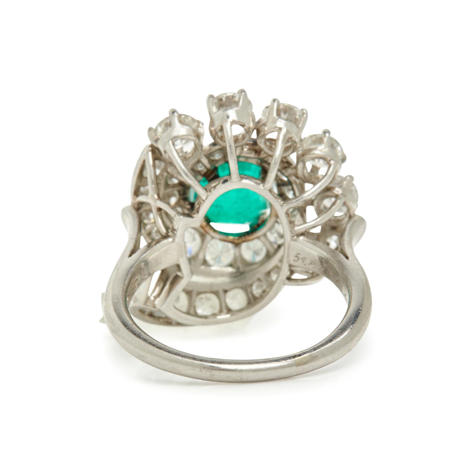 PLATINUM, EMERALD AND DIAMOND RING