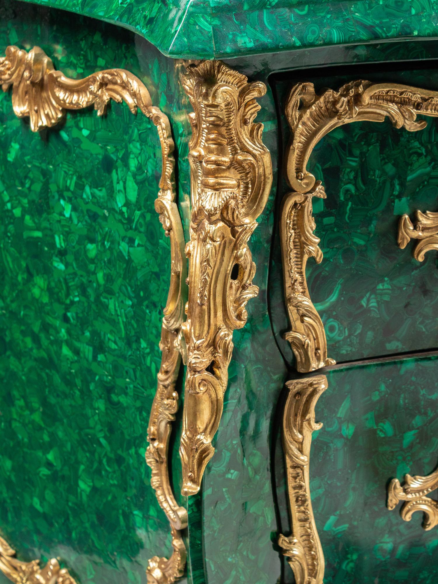 A Pair of Louis XV Style Gilt Bronze Mounted Malachite Commodes