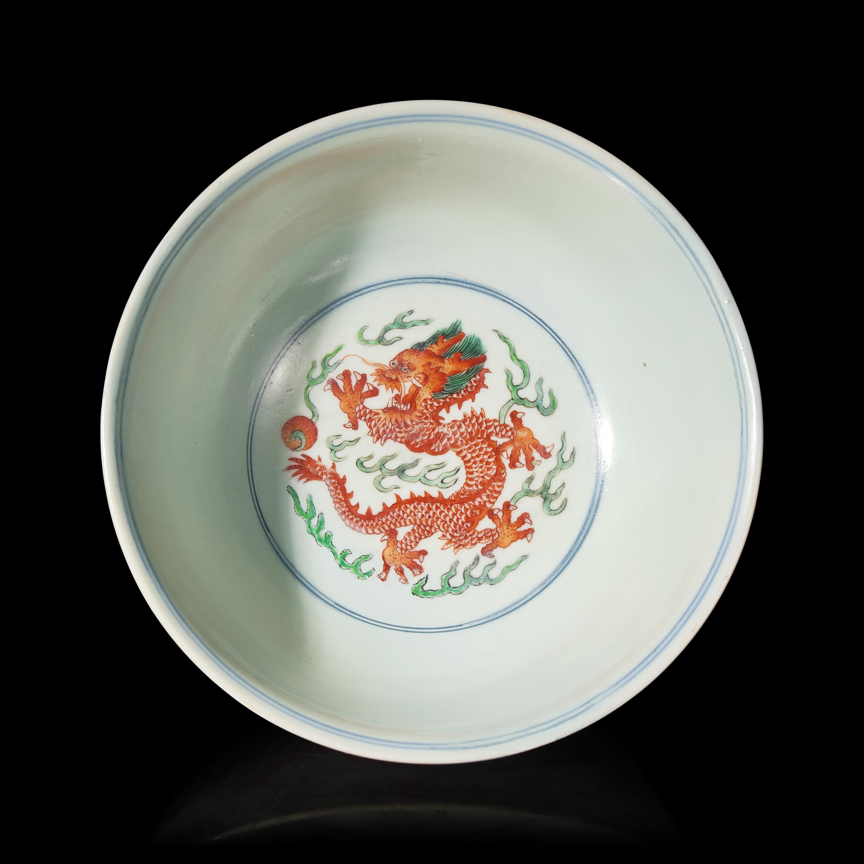 A Chinese Wucai Porcelain 'Dragon and Phoenix' Bowl, Qianlong Mark and of The Period 清乾隆 五彩龍鳳紋宮盌