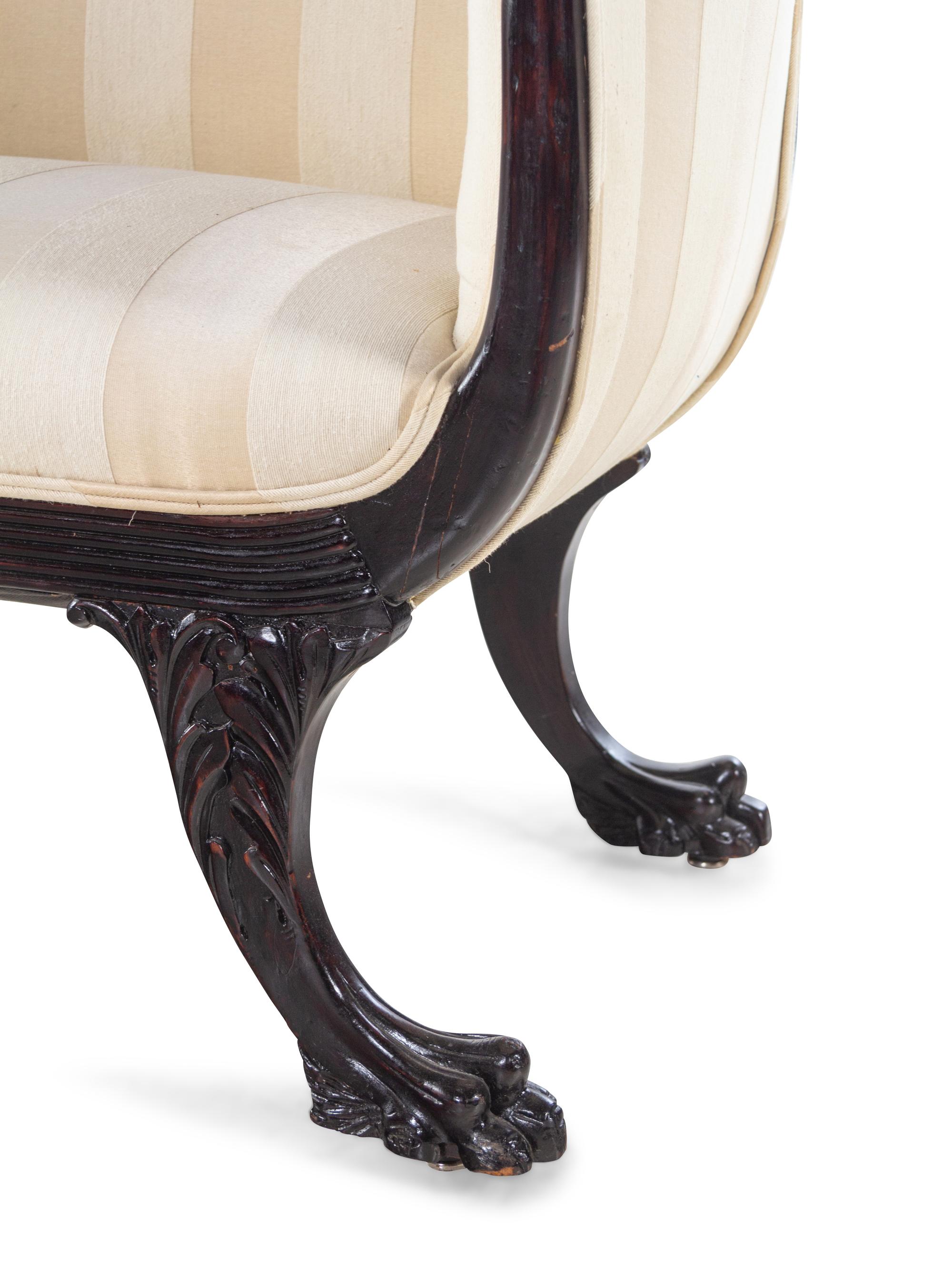 A Victorian Mahogany Settee and Armchair