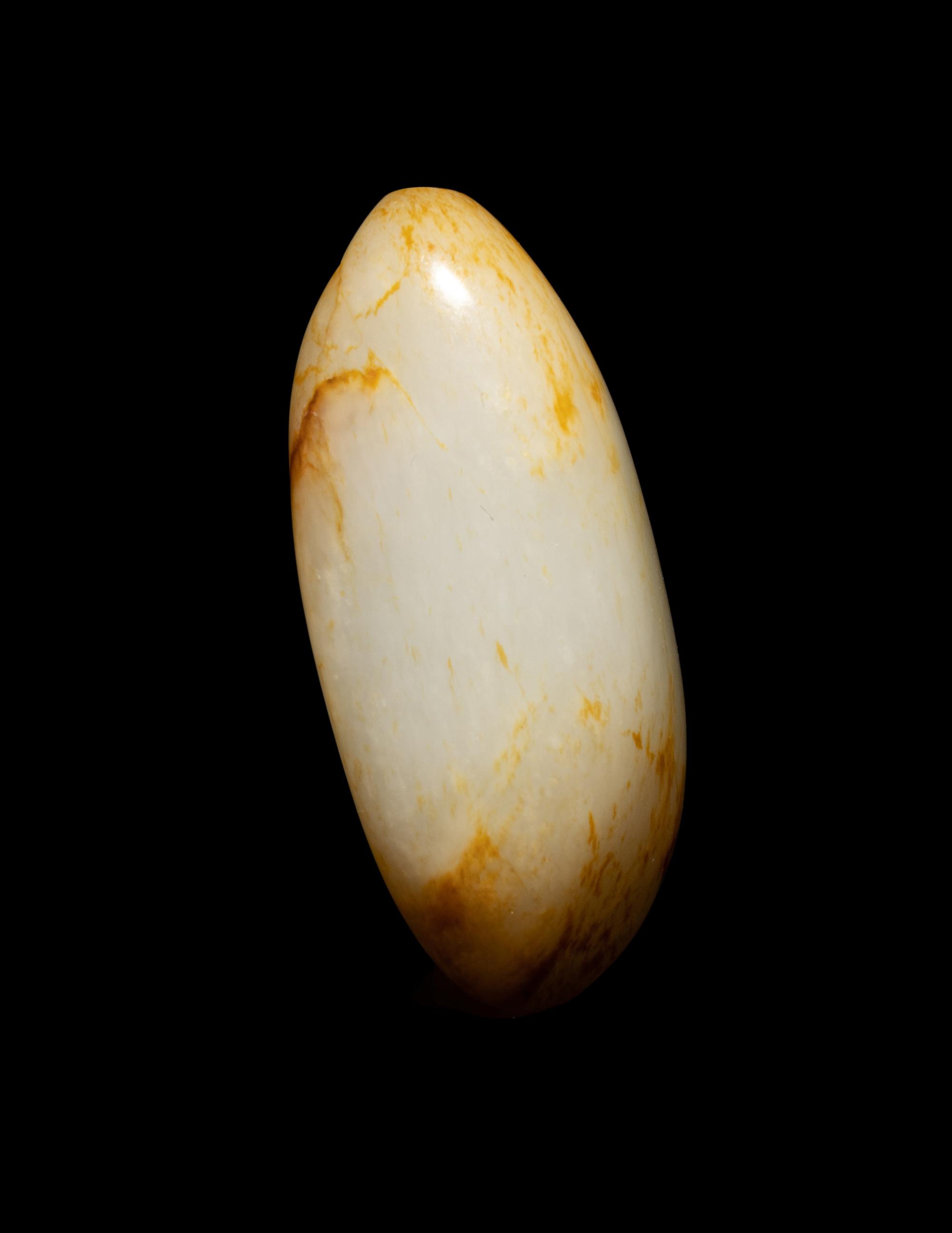 A Chinese Russet and White Jade Pebble-Form Snuff Bottle