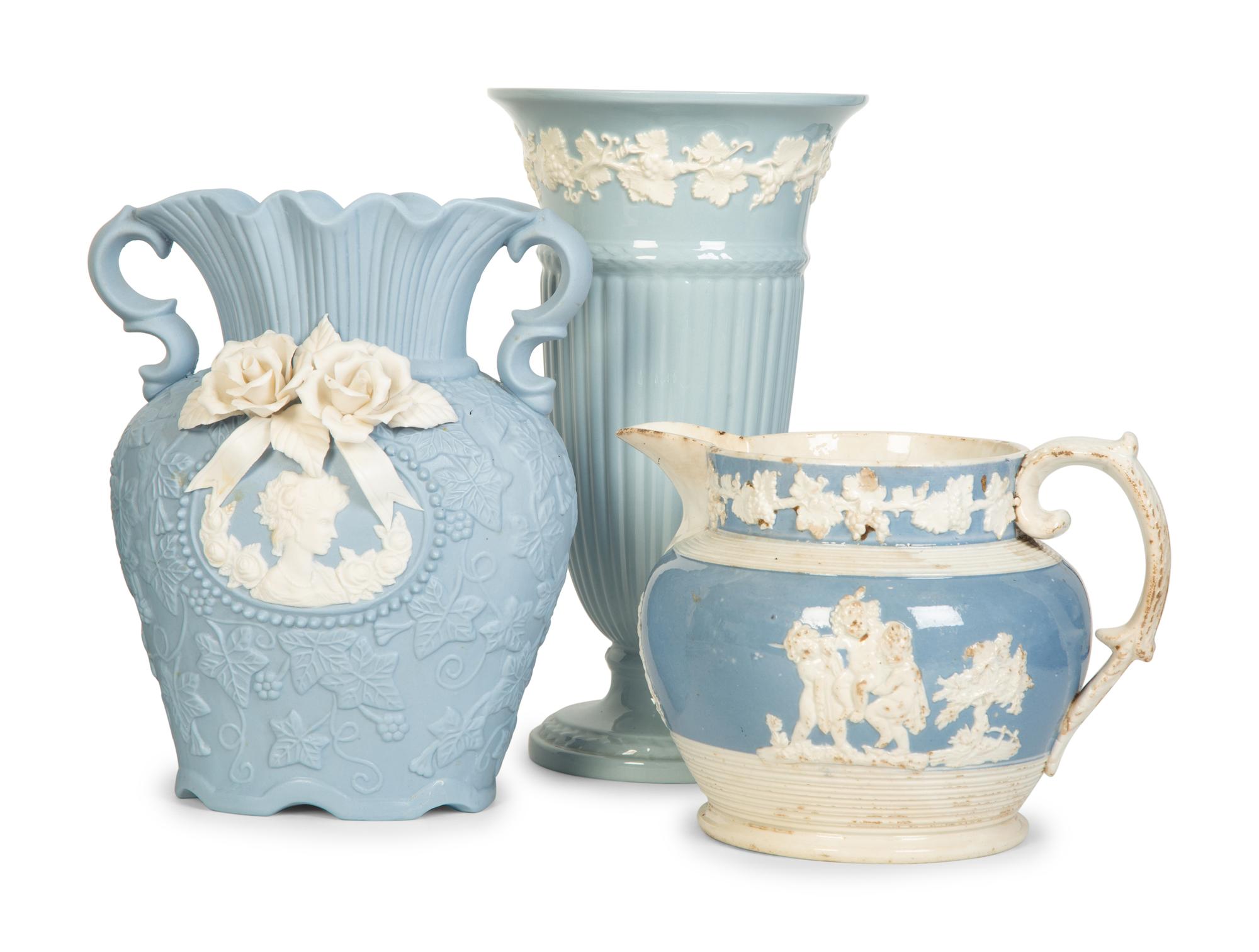 Seven Jasperware Pitchers and Table Articles
