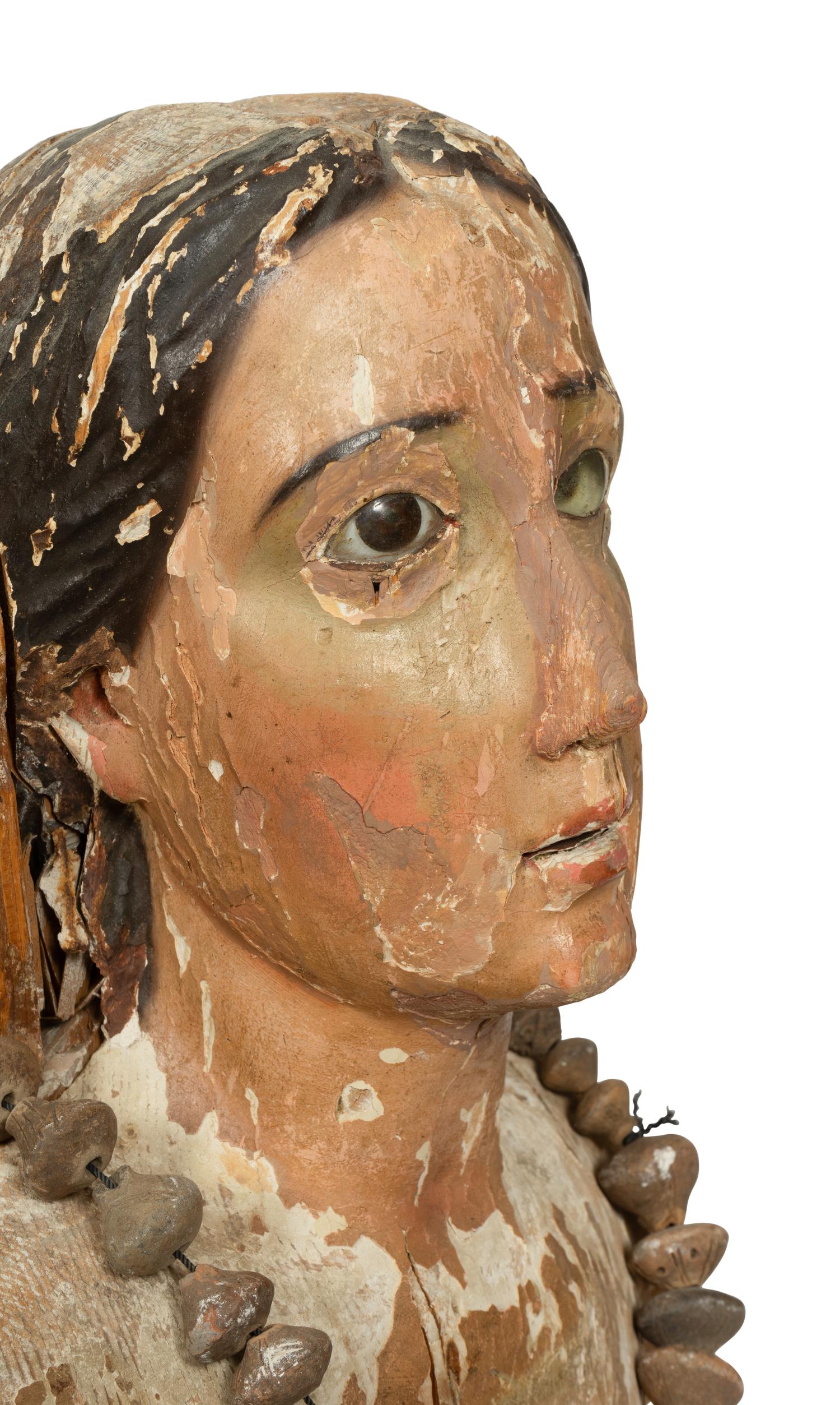 A Continental Carved and Painted Bust of a Saint