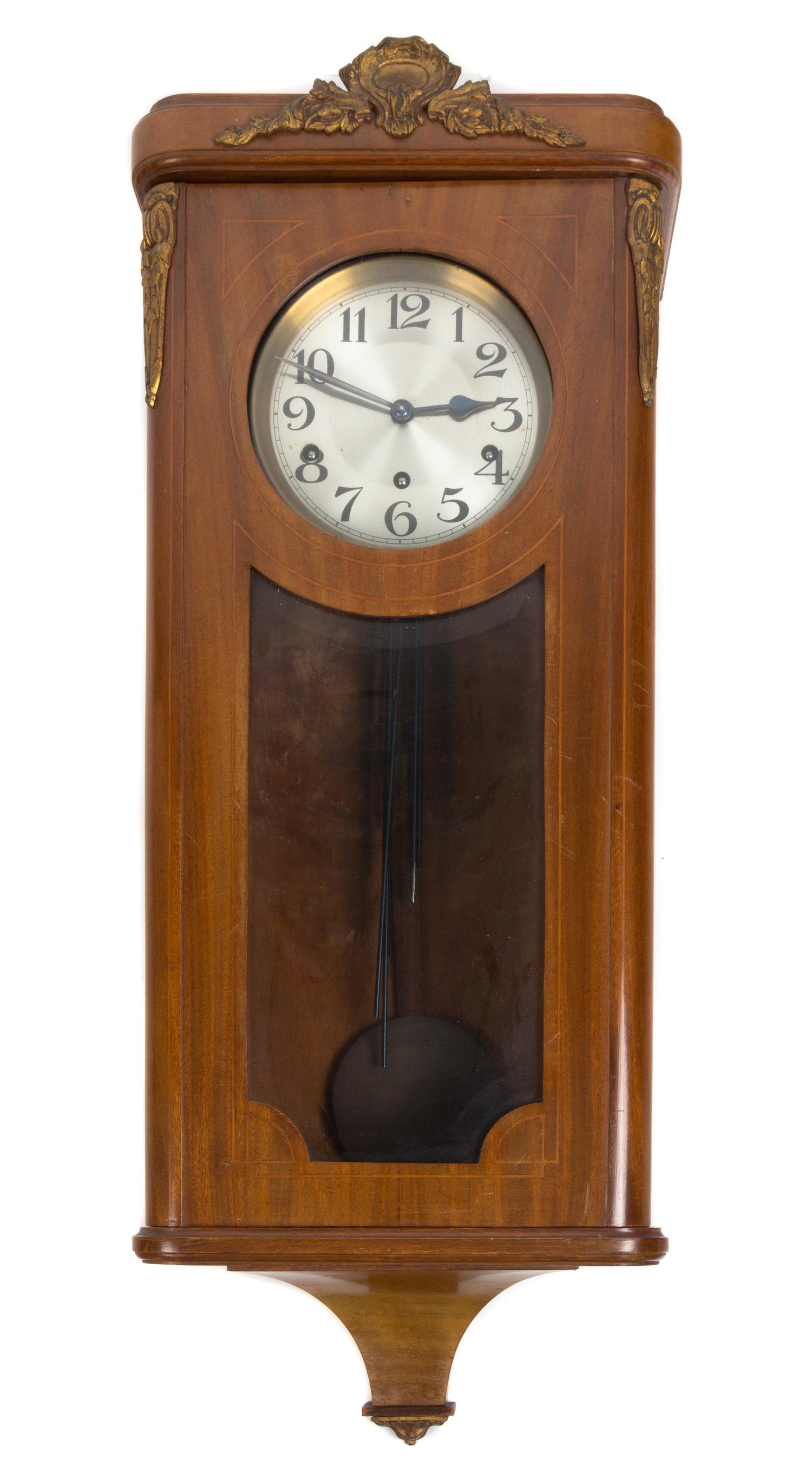 A Continental Walnut Cased Wall Clock Height 32 inches. — 19TH CENTURY