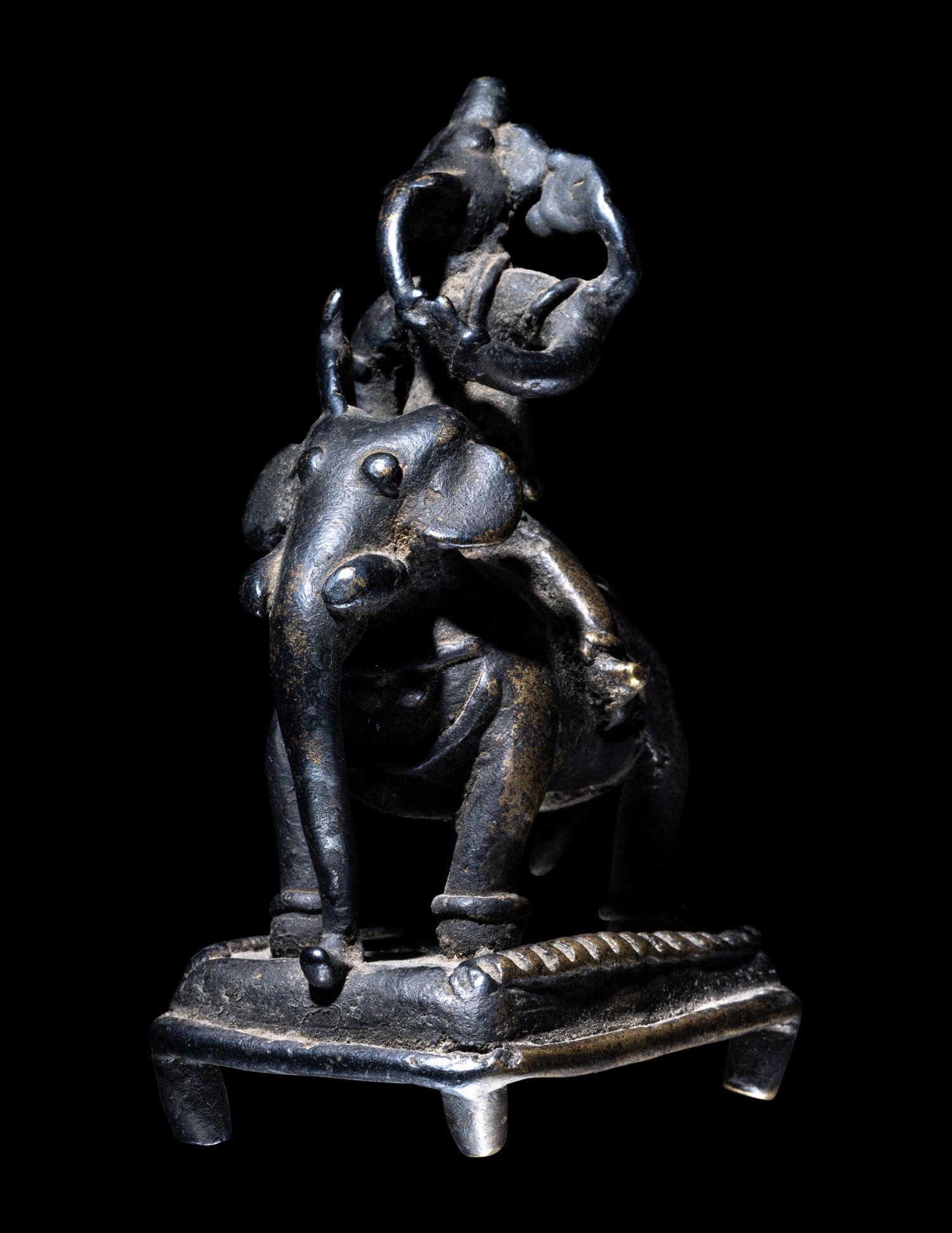 An Indian Bronze Figural Group of Ganesha Riding an Elephant
