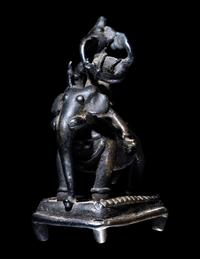 An Indian Bronze Figural Group of Ganesha Riding an Elephant