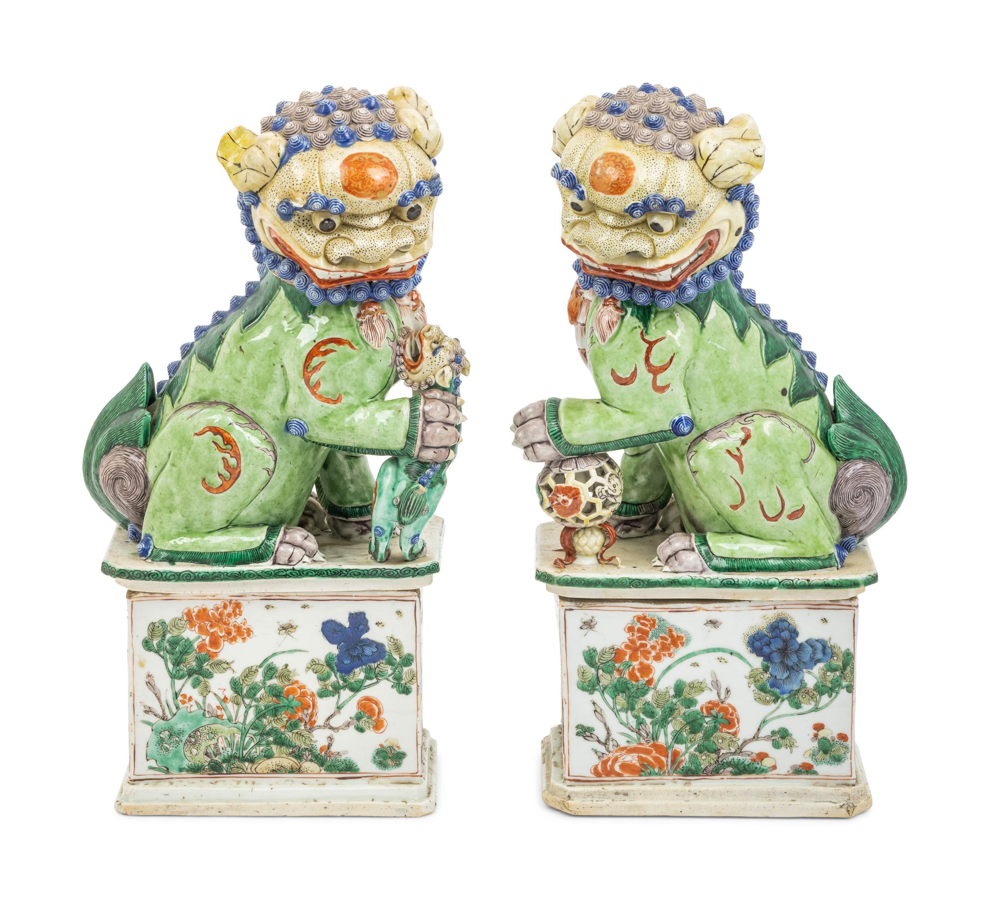 A Pair of Famille Verte Porcelain Figures of Fu Lions