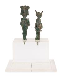 An Egyptian Bronze Osiris and Isis nursing Harpocrates