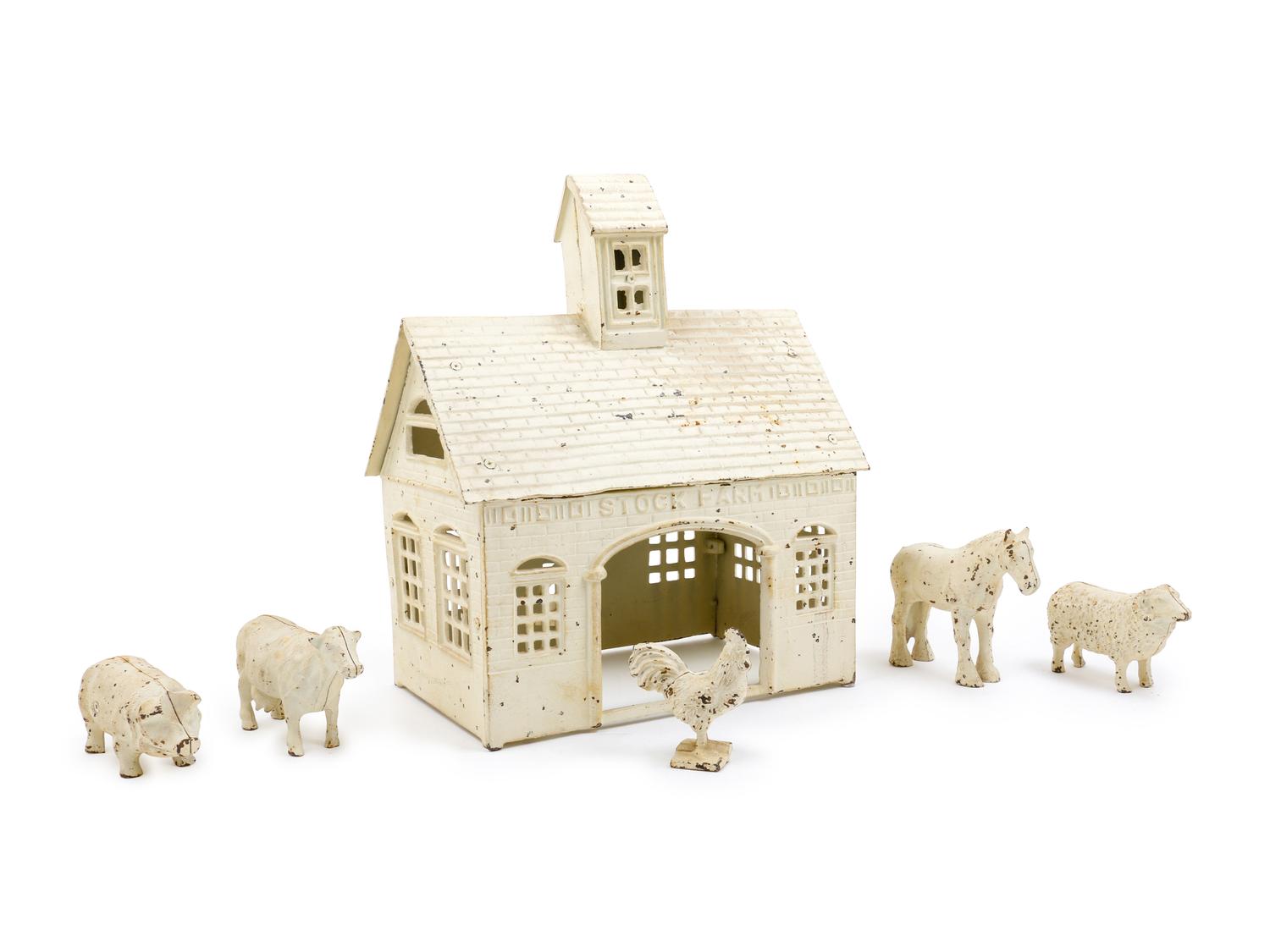 A Painted Metal Toy Barn and Animals