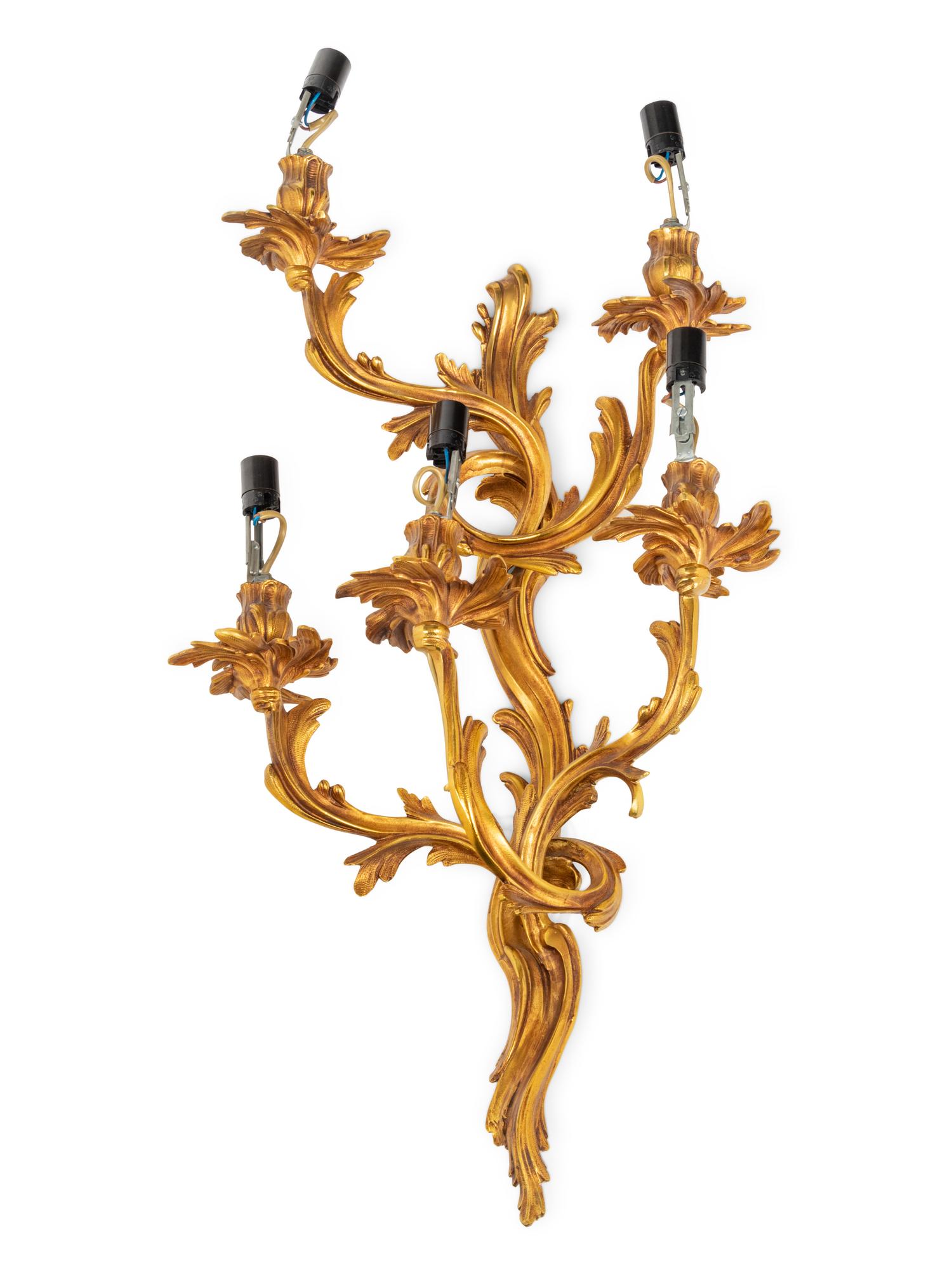 A Set of Four Louis XV Style Gilt Metal Five-Light Sconces
