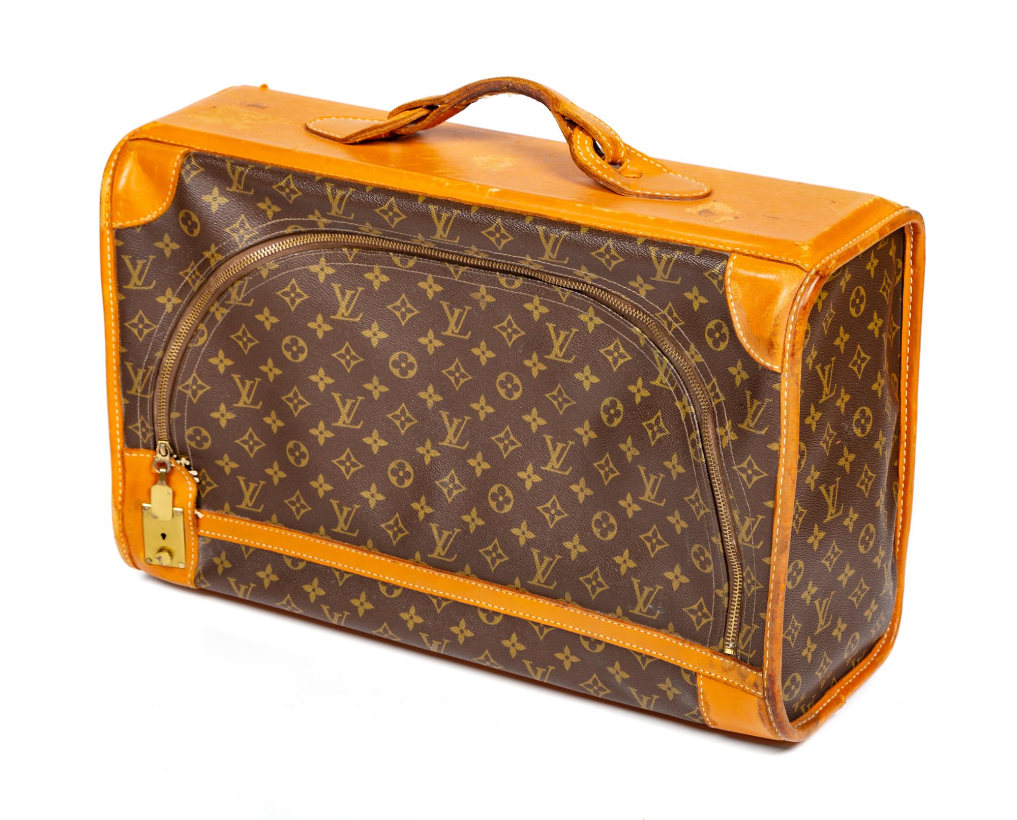 A Louis Vuitton Monogram Canvas Soft Sided Suitcase, 20" L x 12.75" H x 7.5" D; Handle drop: 2.5".