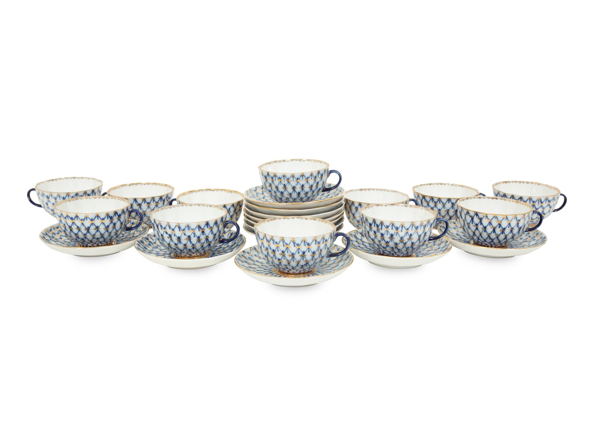 A Set of Twelve Lomonosov Cobalt Net Porcelain Teacups and Saucers