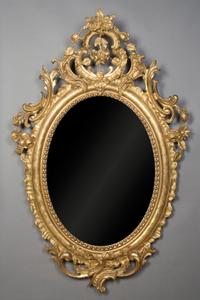 A Continental Giltwood Mirror, Height 62 x width 40 inches.