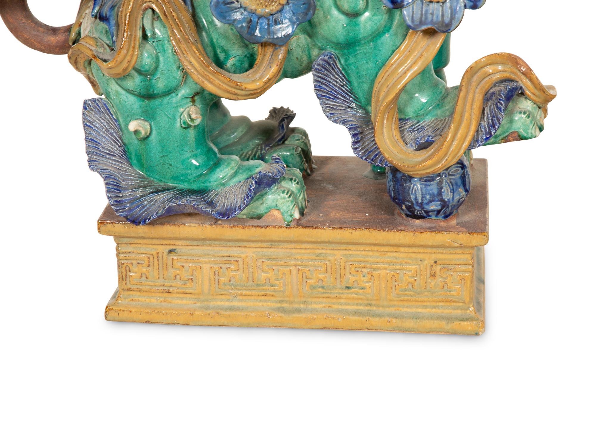 A Pair of Chinese Glazed Ceramic Foo Dogs