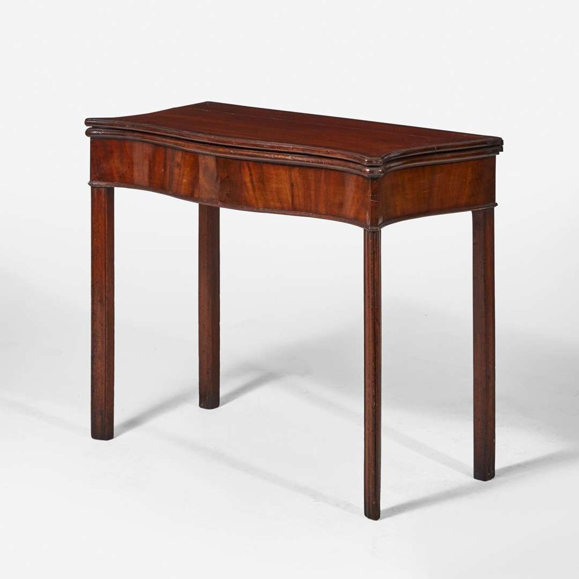 A George III serpentine carved mahogany card table circa 1770