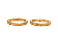HILAT, PAIR OF DIAMOND AND HIGH KARAT GOLD BANGLE BRACLELETS