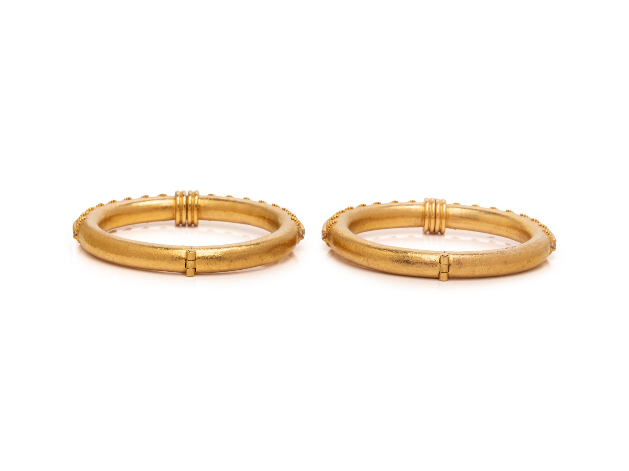 HILAT, PAIR OF DIAMOND AND HIGH KARAT GOLD BANGLE BRACLELETS