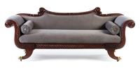 An Empire Mahogany Carved Sofa Height 34 1/2 x width 85 x depth 24 inches. — CIRCA 1850