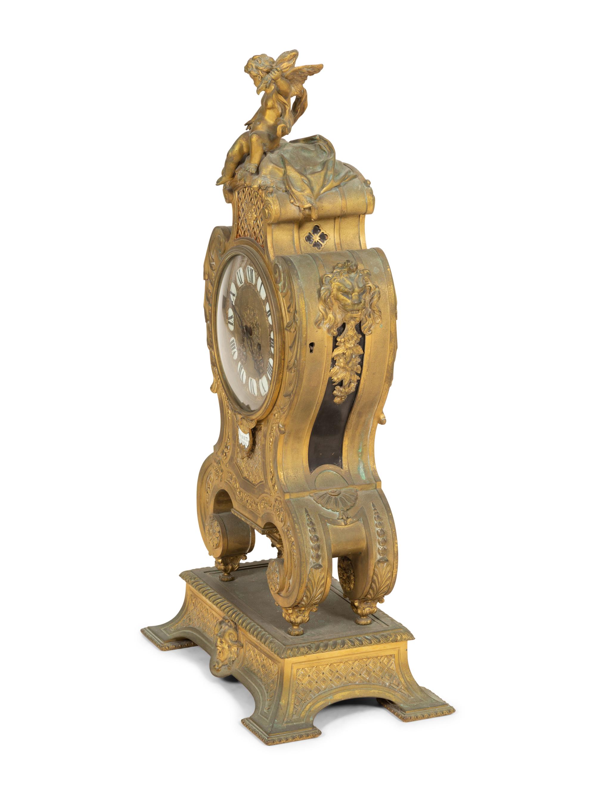A Louis XV Style Gilt Bronze Mantle Clock on Stand
